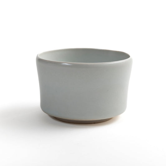 Side view of ivory white travel tea bowl