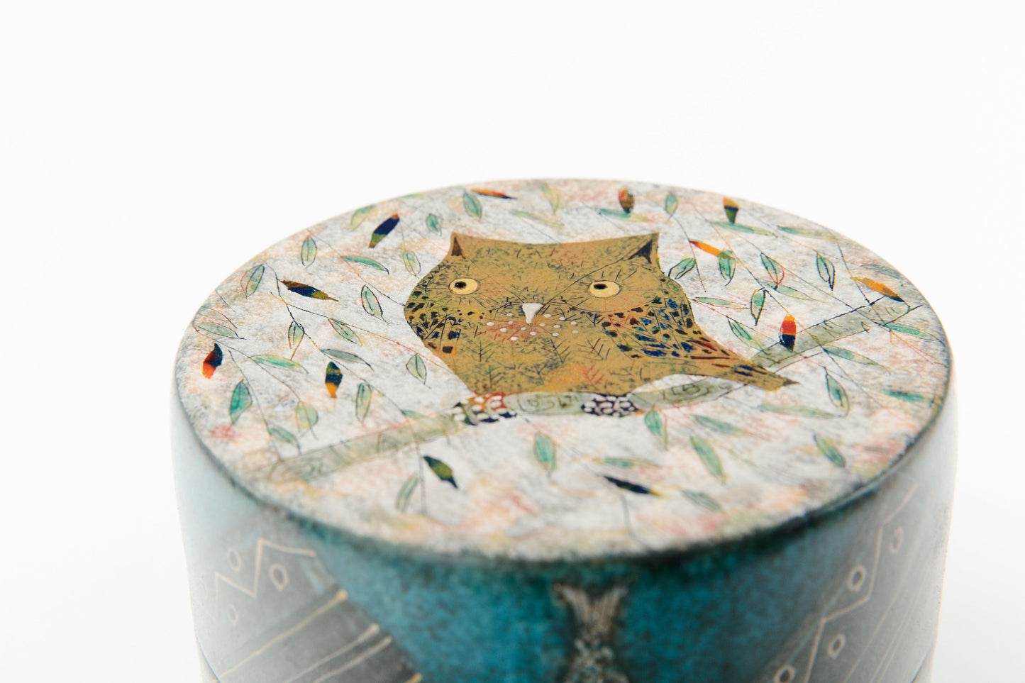 Handcrafted japanese ceramic lidded box by Ito Hokuto with owl motif and gold silver accents, top view | wanova
