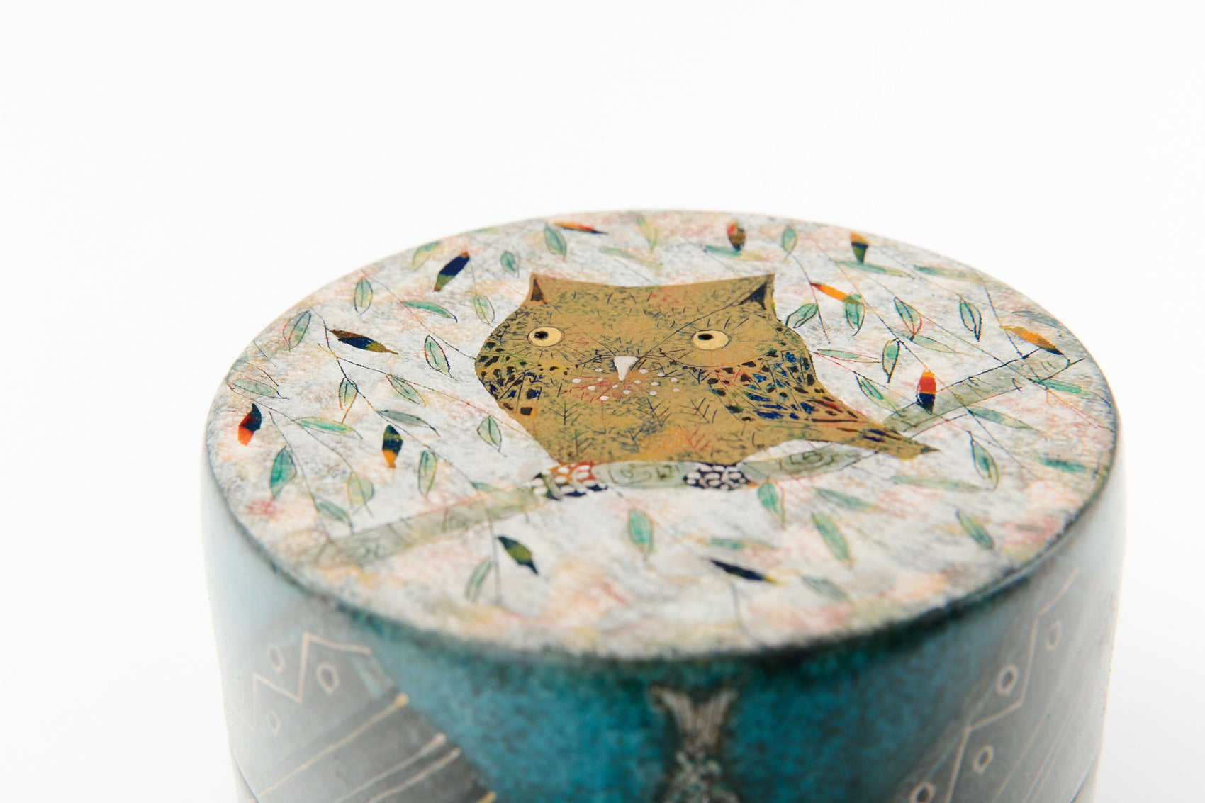 Handcrafted japanese ceramic lidded box by Ito Hokuto with owl motif and gold silver accents, top view | wanova