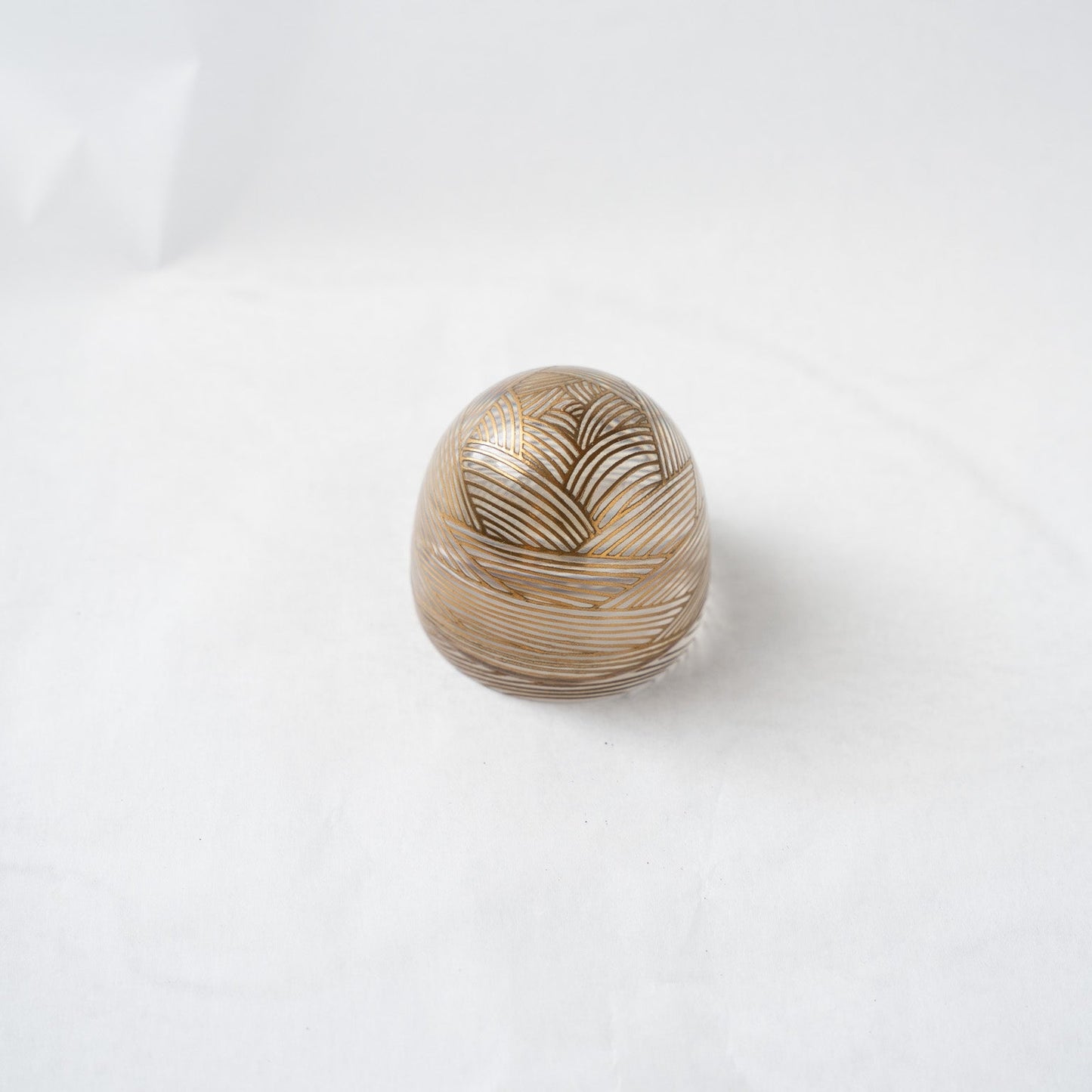 An elevated, angled view of the closed dome box, emphasizing its clean curvature, geometric lines, and the play of light through the resin.