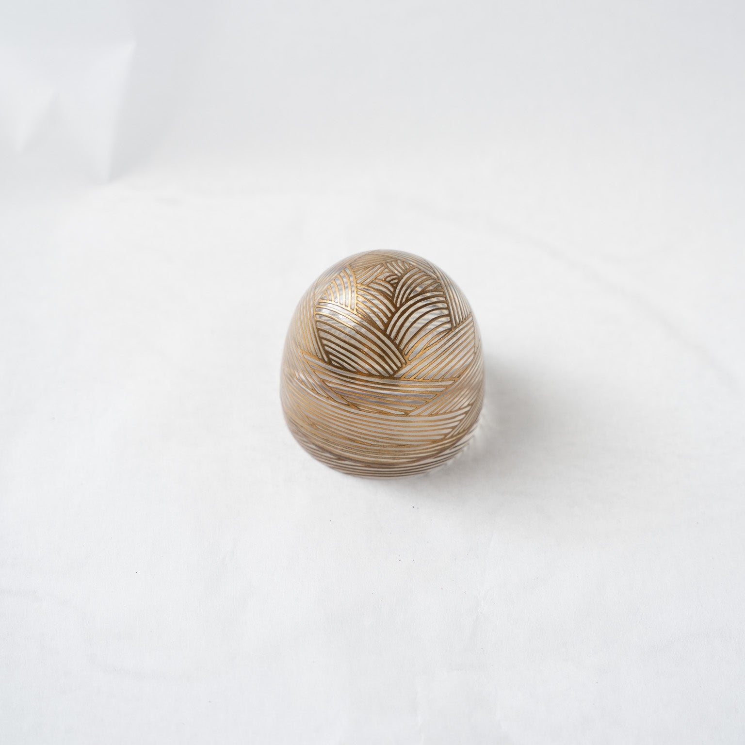 An elevated, angled view of the closed dome box, emphasizing its clean curvature, geometric lines, and the play of light through the resin.
