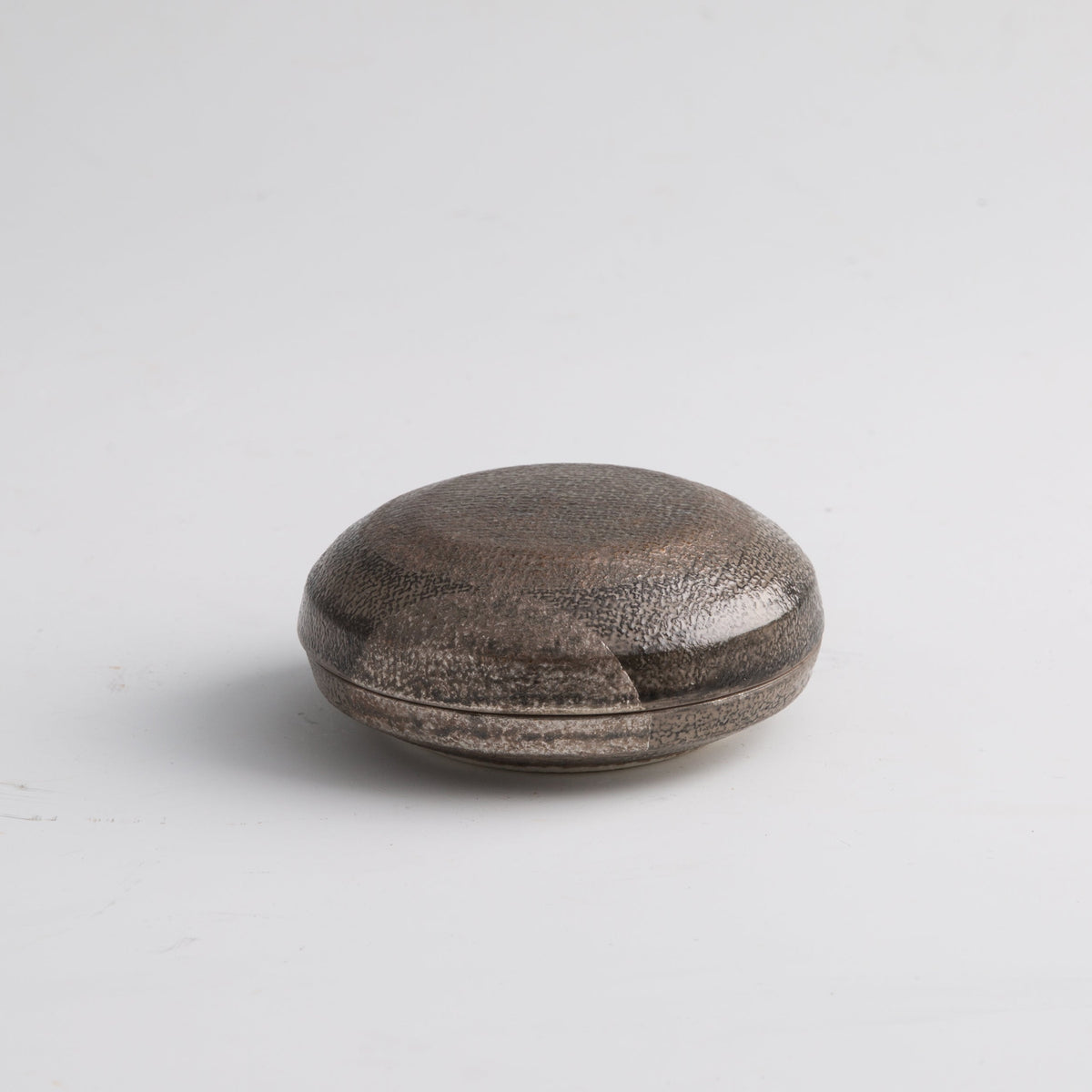 Minimalist round incense container in metallic grey glaze