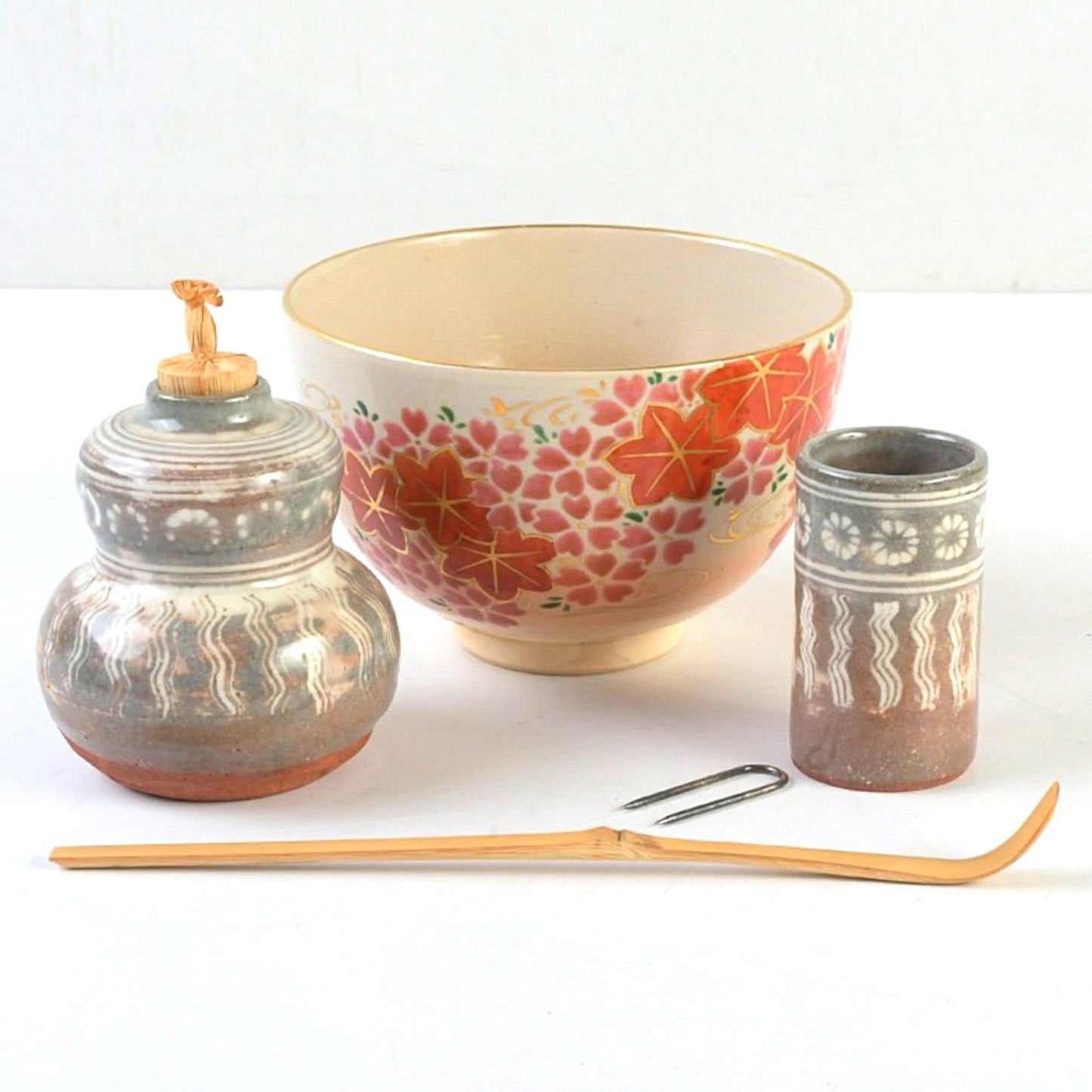 Overglaze enamel CHAWAN with cherry blossoms and autumn leaves, alongside an ash-glazed FURIDASHI and stamped CHAKIN-ZUTSU.