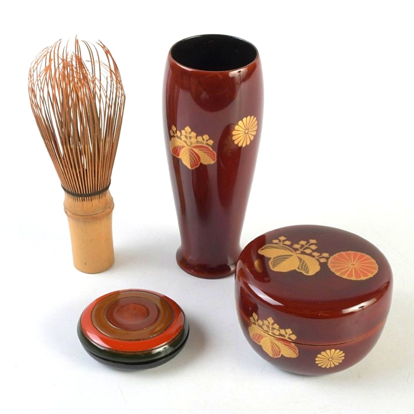 Tame-nuri lacquer NATSUME and CHASENTSUTSU with gold chrysanthemum and paulownia maki-e, next to a bamboo whisk and KOGO