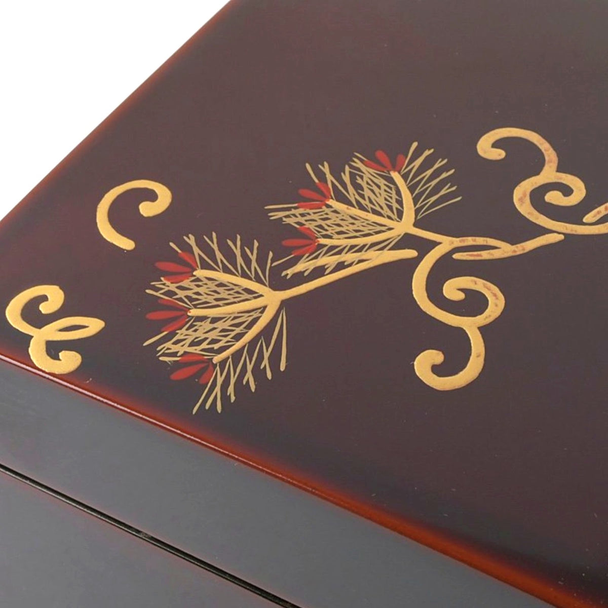 Close-up of the delicate pine needles and subtle red accents in the maki-e lacquer work