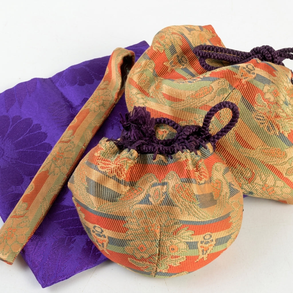 Elegant silk shifuku pouches and a purple fukusa cloth, displaying traditional woven textures