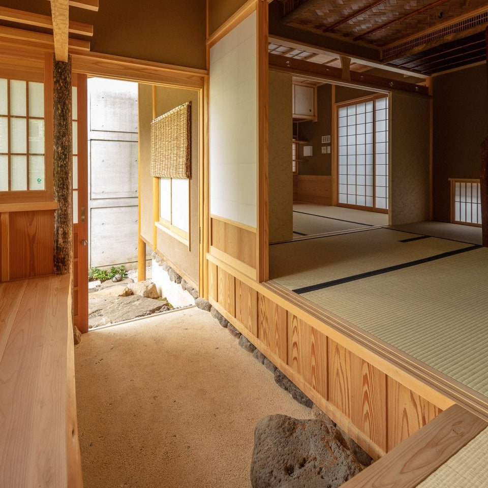 Engawa corridor with an indoor sand garden leading to tatami rooms, traditional Japanese architecture of the chashitsu.