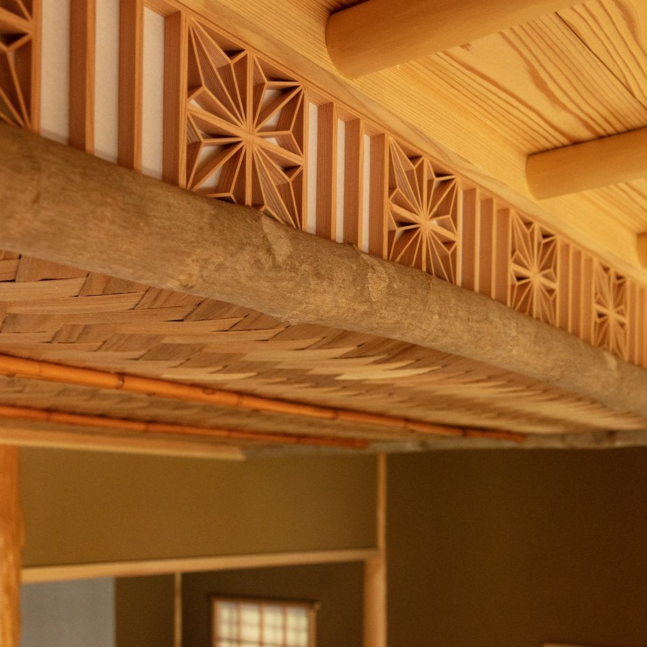 Close-up of hand-crafted asanoha kumiko latticework and woven bamboo, a fine Japanese architecture detail in the chashitsu.