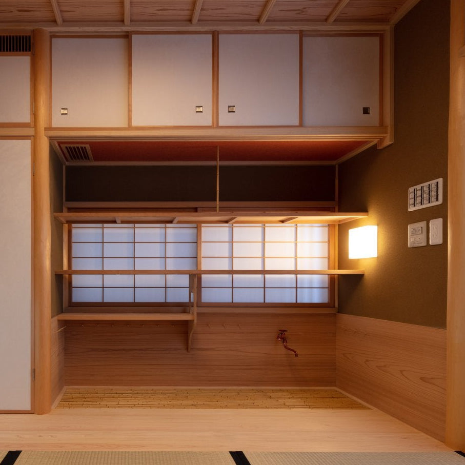 Mizuya preparation room with cedar shelving and shoji screens, a functional detail of Japanese tea room architecture.