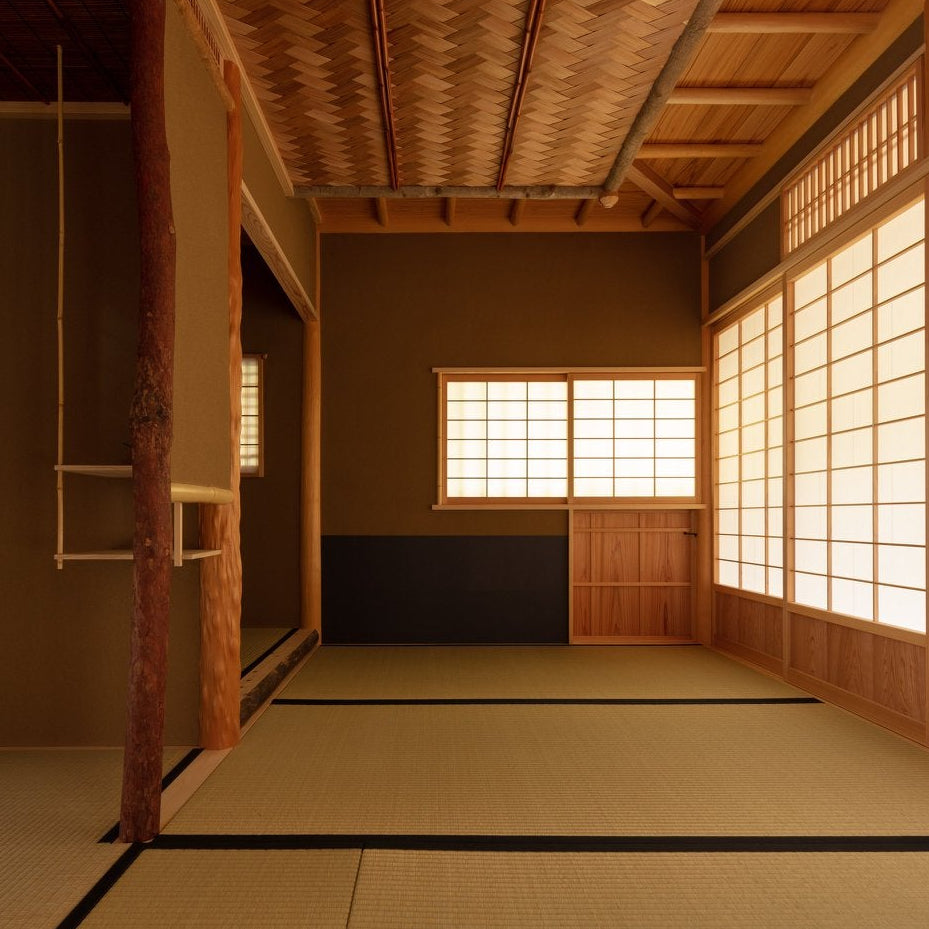 Tatami tea room interior with a woven bamboo ceiling and shoji screens, traditional Japanese architecture in a Roppongi chashitsu.