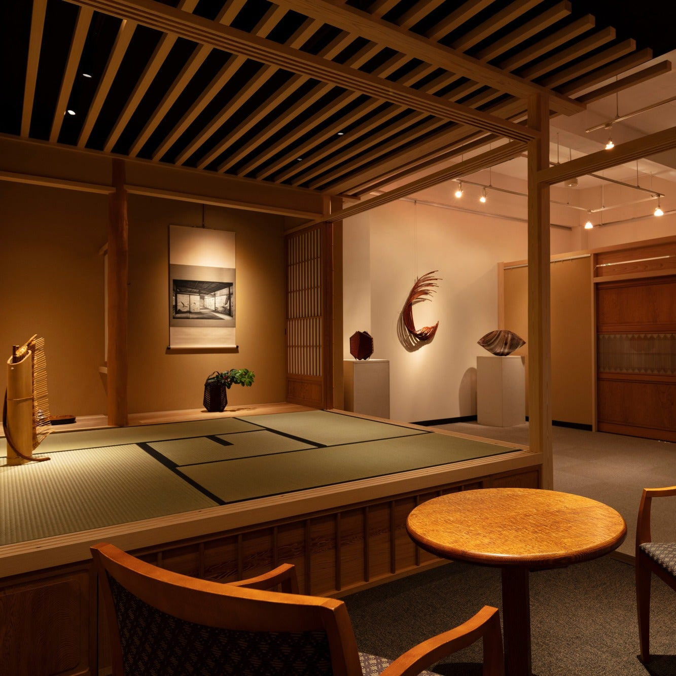 A chashitsu opening onto a gallery of contemporary bamboo and ceramic art in Ginza, Tokyo.