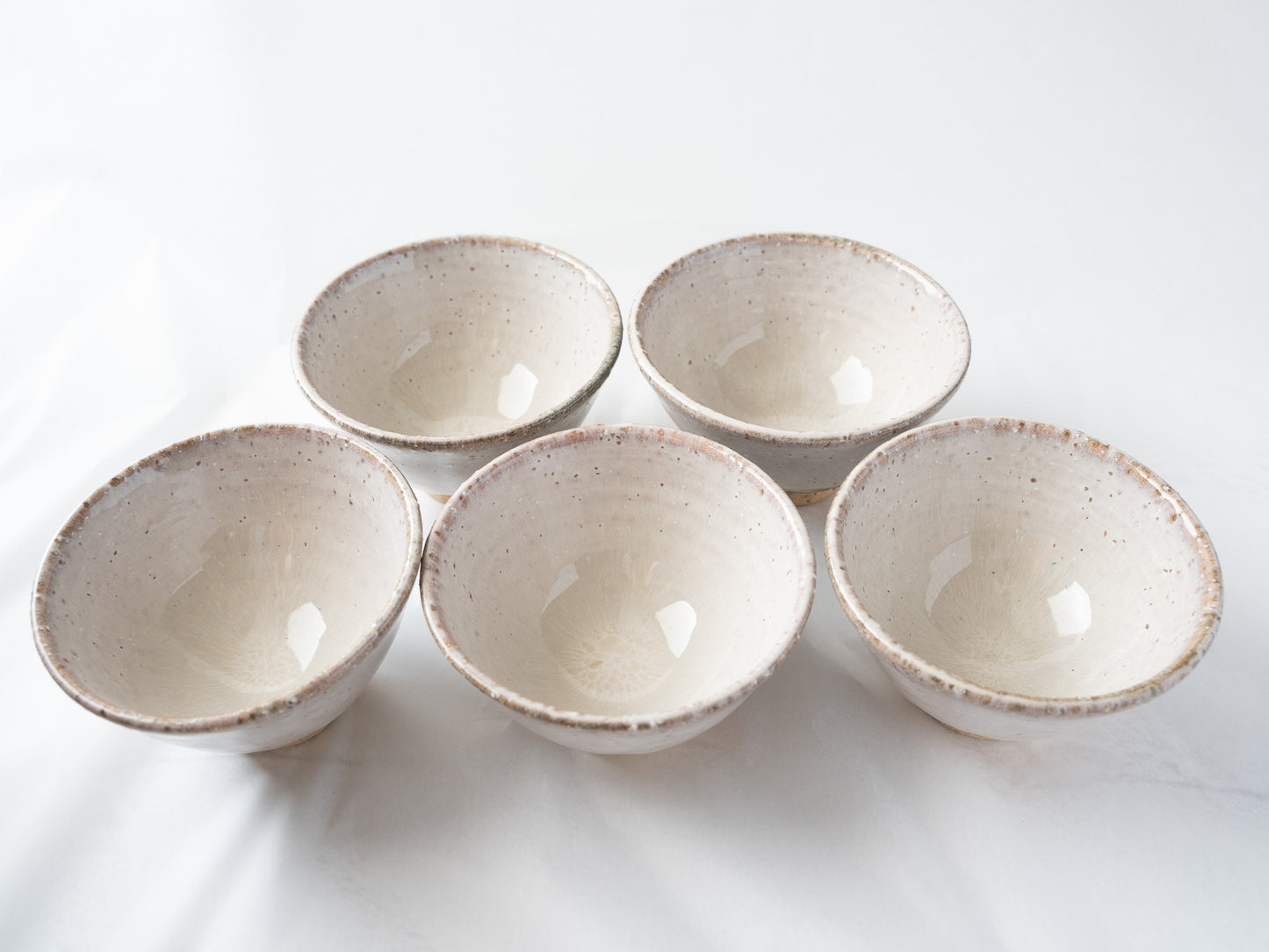 Alternative front view of the five-piece Hagiyaki cup set, highlighting the gentle asymmetry, natural texture, and elegant flared rims designed for drinking sencha.