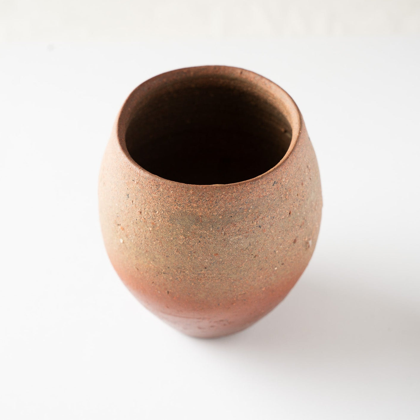 lternative high-angle view highlighting the natural color gradient from the ash-dusted matte rim to the smooth terracotta-colored lower body.
