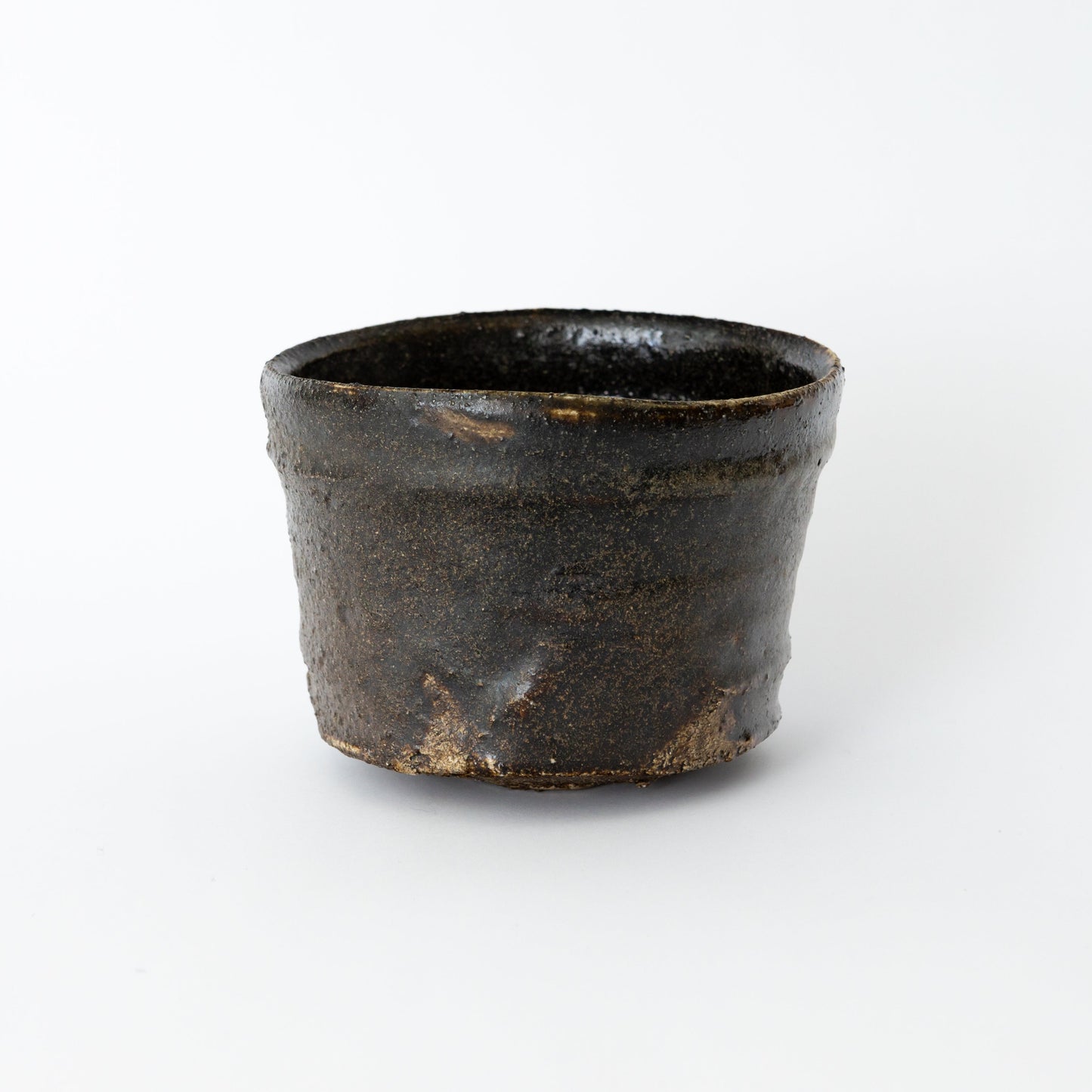 Alternate view of an Oribe Chawan tea bowl by Kai Tsujimura, showing its quiet irregular contour and firing character.