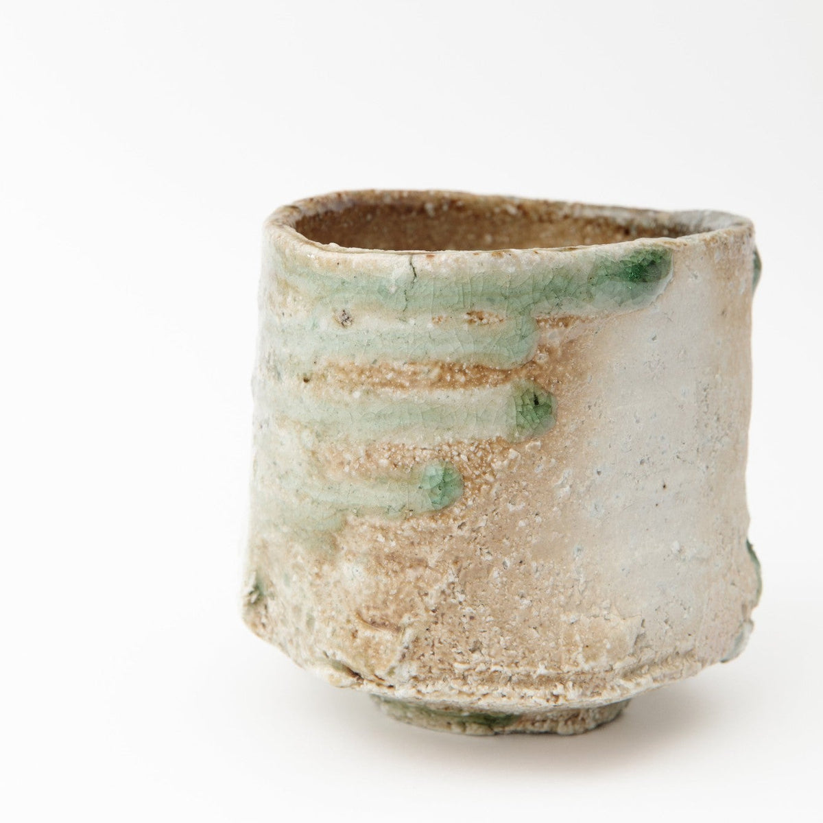 The bowl from another side with the flame-scorched orange band and a thick irregular rim.