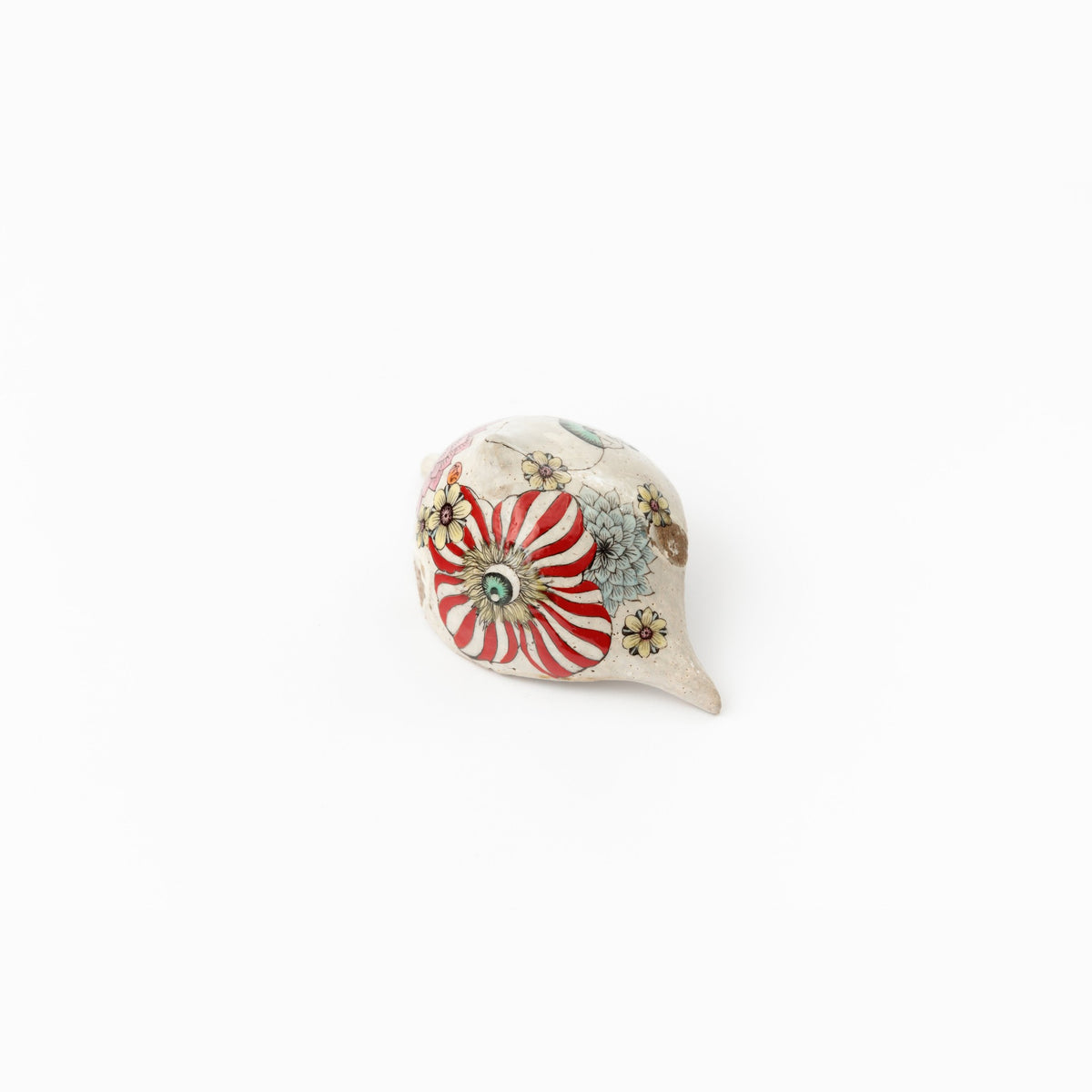 The opposite end in close view, the red-and-white striped figure and small black details.