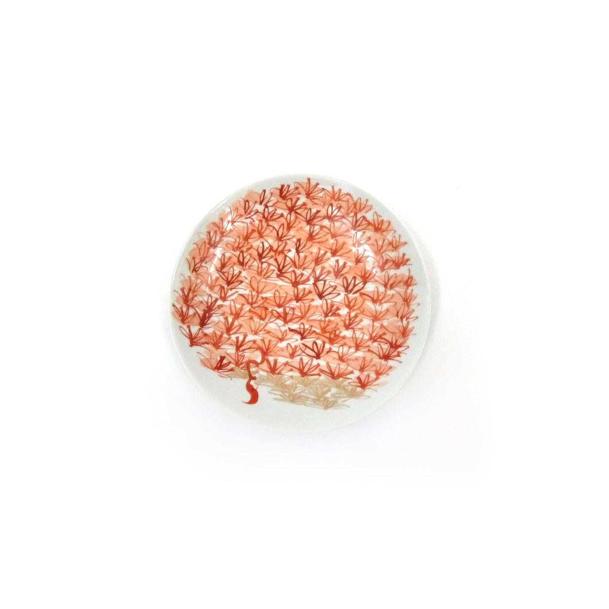 View from above with the plate tilted, the red blossom clusters covering the whole surface.
