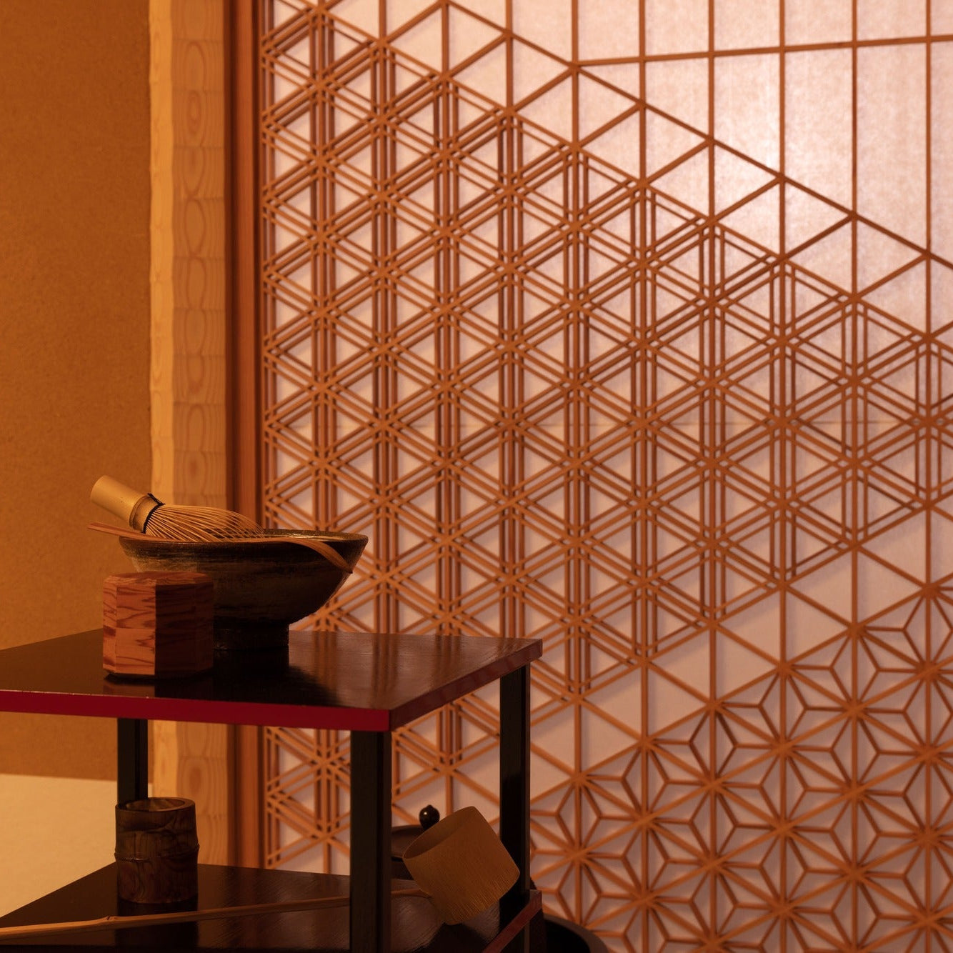 Tea bowl, whisk and bamboo wares arranged on a lacquer stand before an asanoha screen, ready for chashitsu.