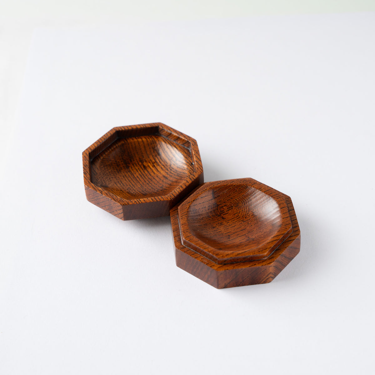Open view of Osamu Oyama's octagonal Keyaki wood KOGO incense container, displaying the carved inner hollows of both base and lid.