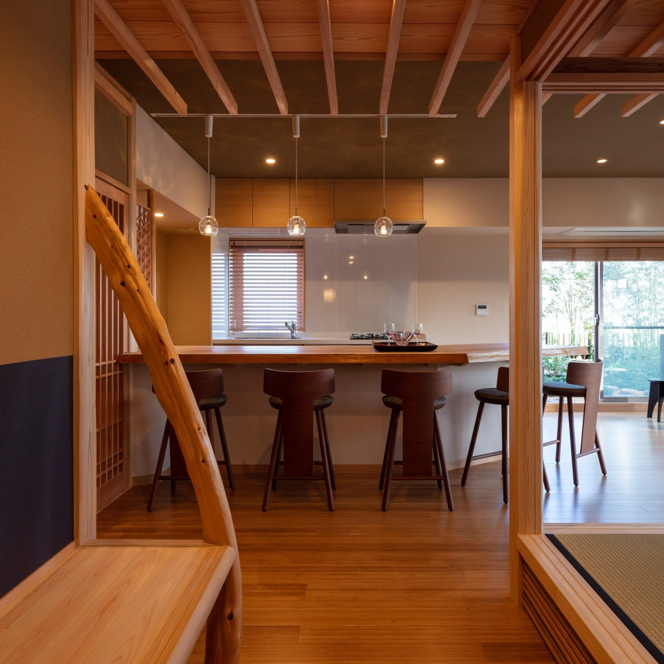 View from the waiting bench through timber posts toward the salon counter and the tatami hall beyond.