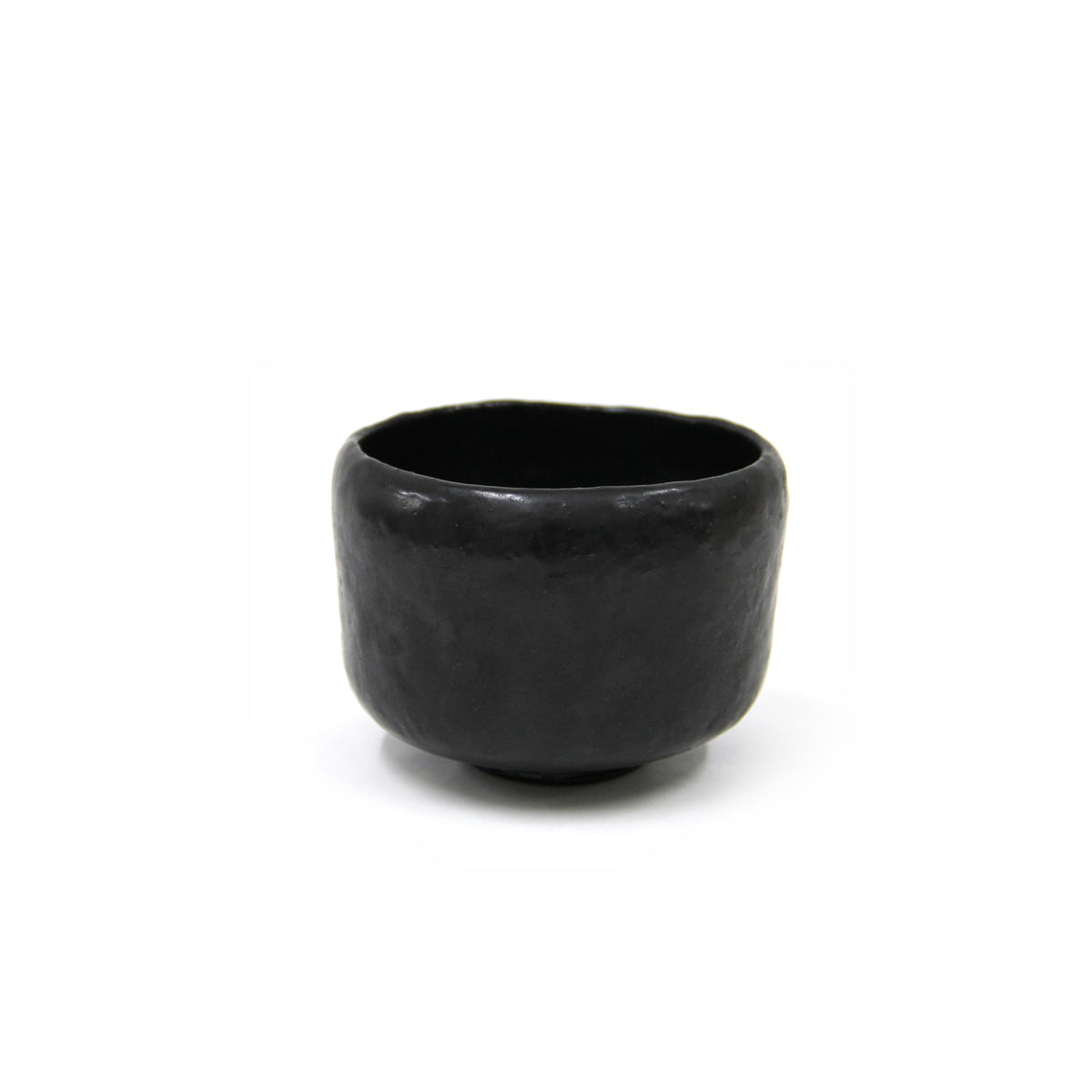Three-quarter view of the bowl from slightly above, the softly inward-curving rim and even black surface.