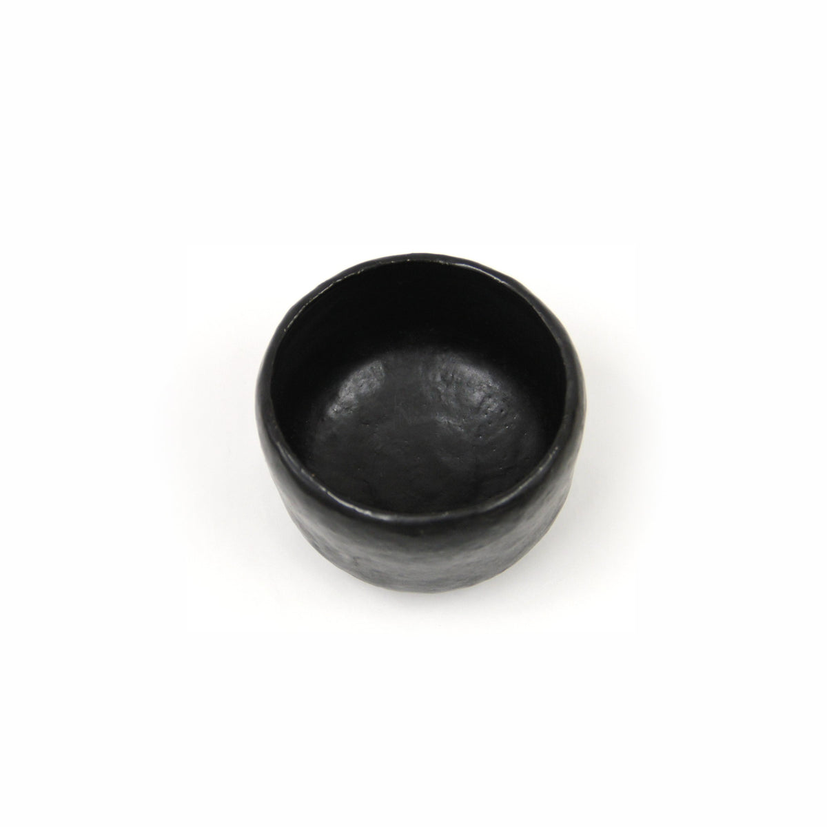 View down into the bowl showing the smooth dark interior and the well.