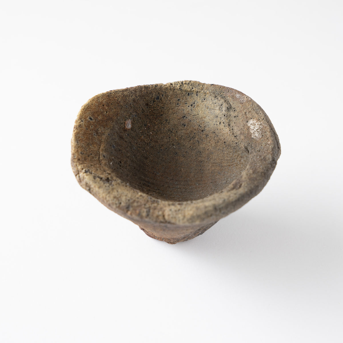 High-angle view showing the deep inner basin and undulating rim of the GUINOMI sake cup by Tamotsu Funakoshi.