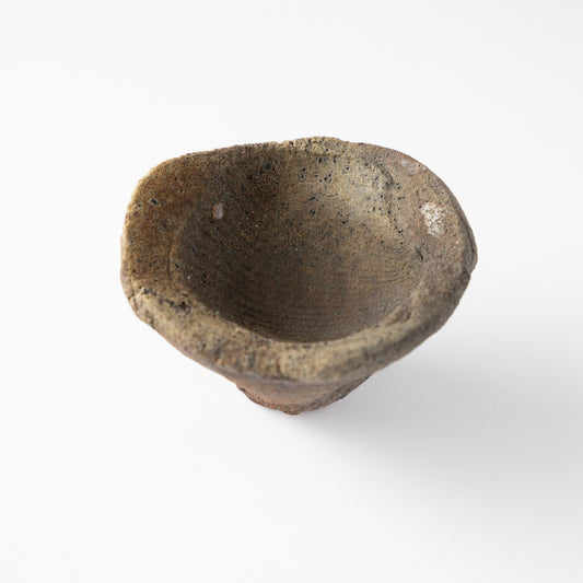 High-angle view showing the deep inner basin and undulating rim of the GUINOMI sake cup by Tamotsu Funakoshi.