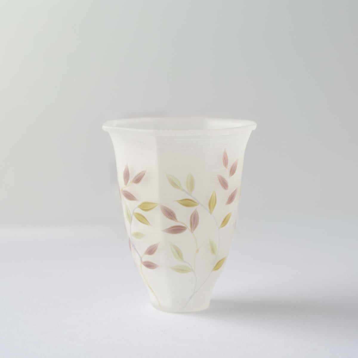 Turned side view of the frosted octagonal glass GUINOMI by Toru Sato, highlighting the soft satin finish and faceted edges.
