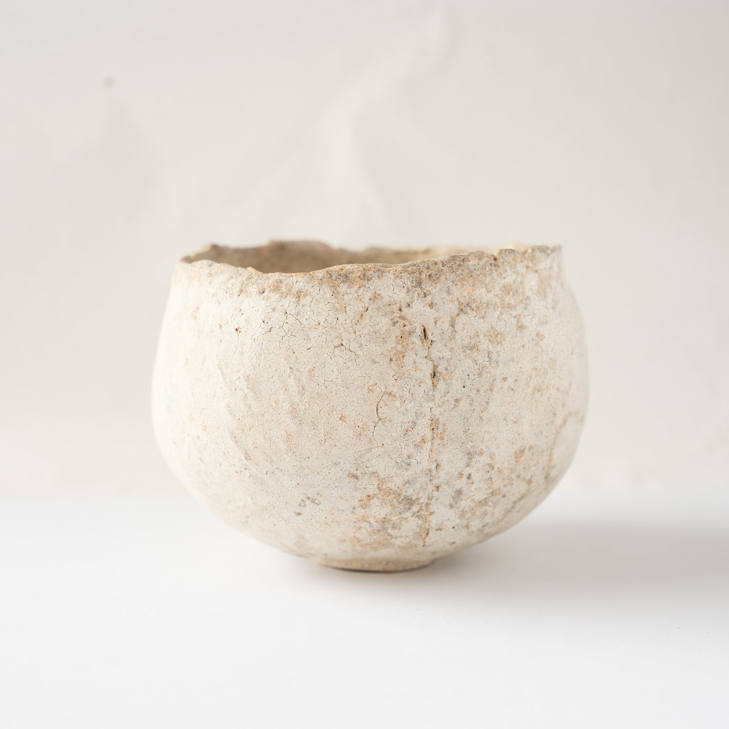 Front view of the Bao small CHAWAN tea bowl by Wataru Myosyu against a bright studio background.