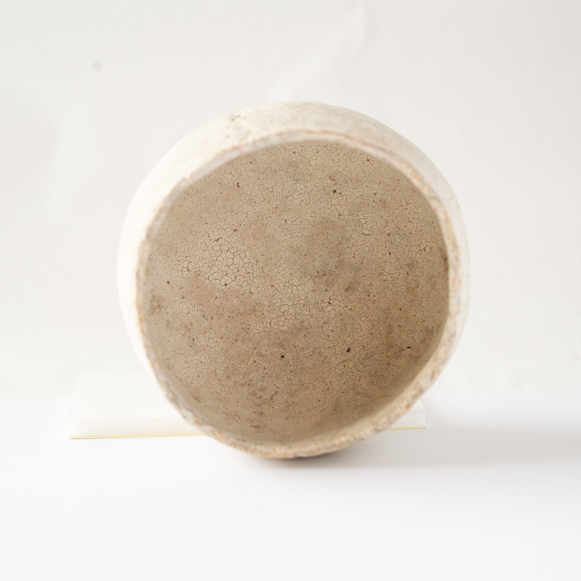 Looking directly into the interior of Wataru Myosyu's Bao small CHAWAN tea bowl, showing fine crackle glaze patterns.
