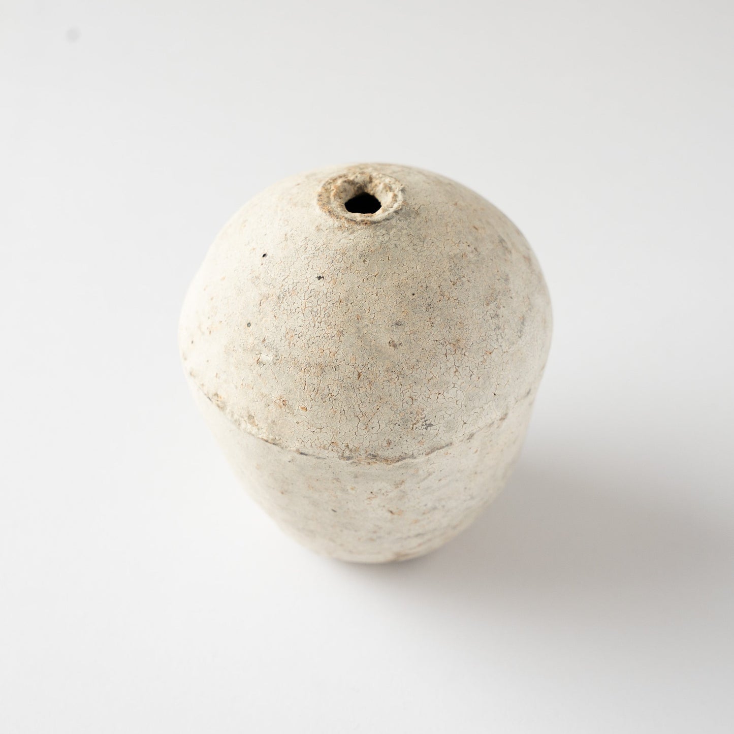 Top perspective of the Hakkoku Ko ceramic HANAIRE vase by Wataru Myosyu, emphasizing its organic curvature and chalky matte finish.