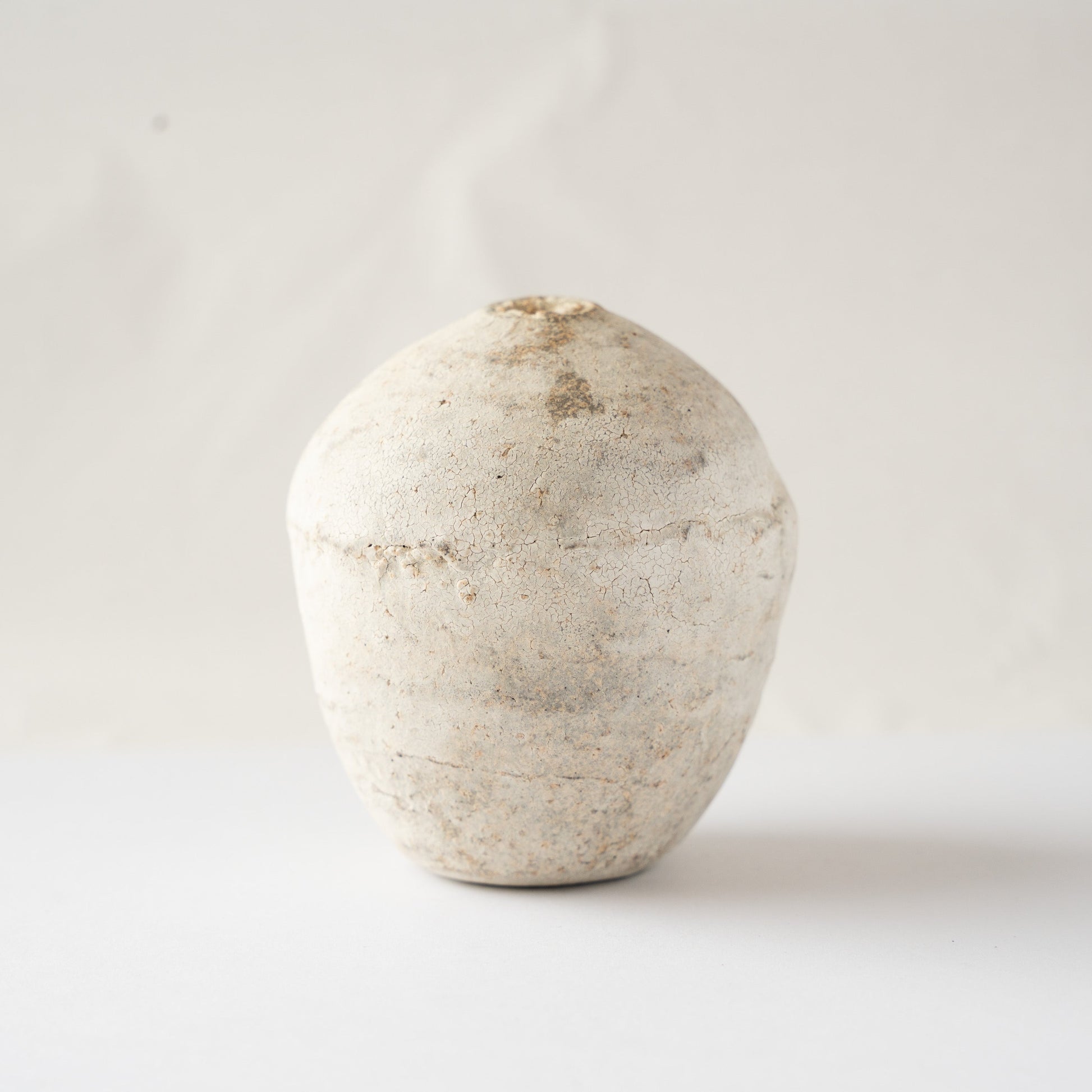 Alternate turned view of the Hakkoku Ko HANAIRE flower vase by Wataru Myosyu, detailing the weathered mineral-like ceramic texture.