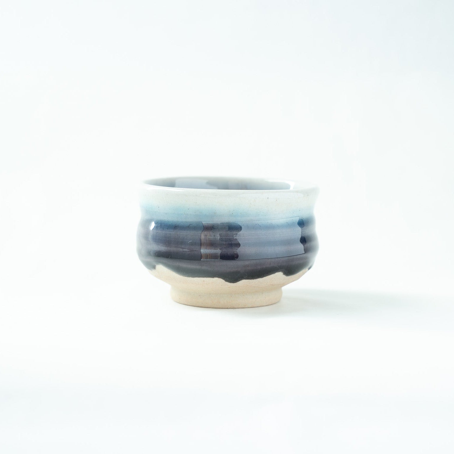 Side profile of the Kutani GUINOMI, showcasing the smooth transition of color from pale mist to dark purple-blue.